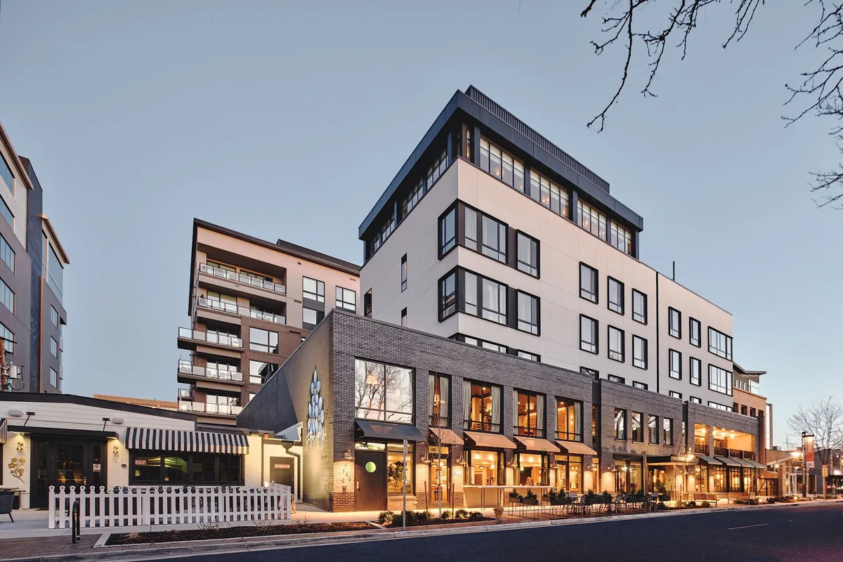The exterior of Clayton Hotel & Members Club in Cherry Creek at dusk